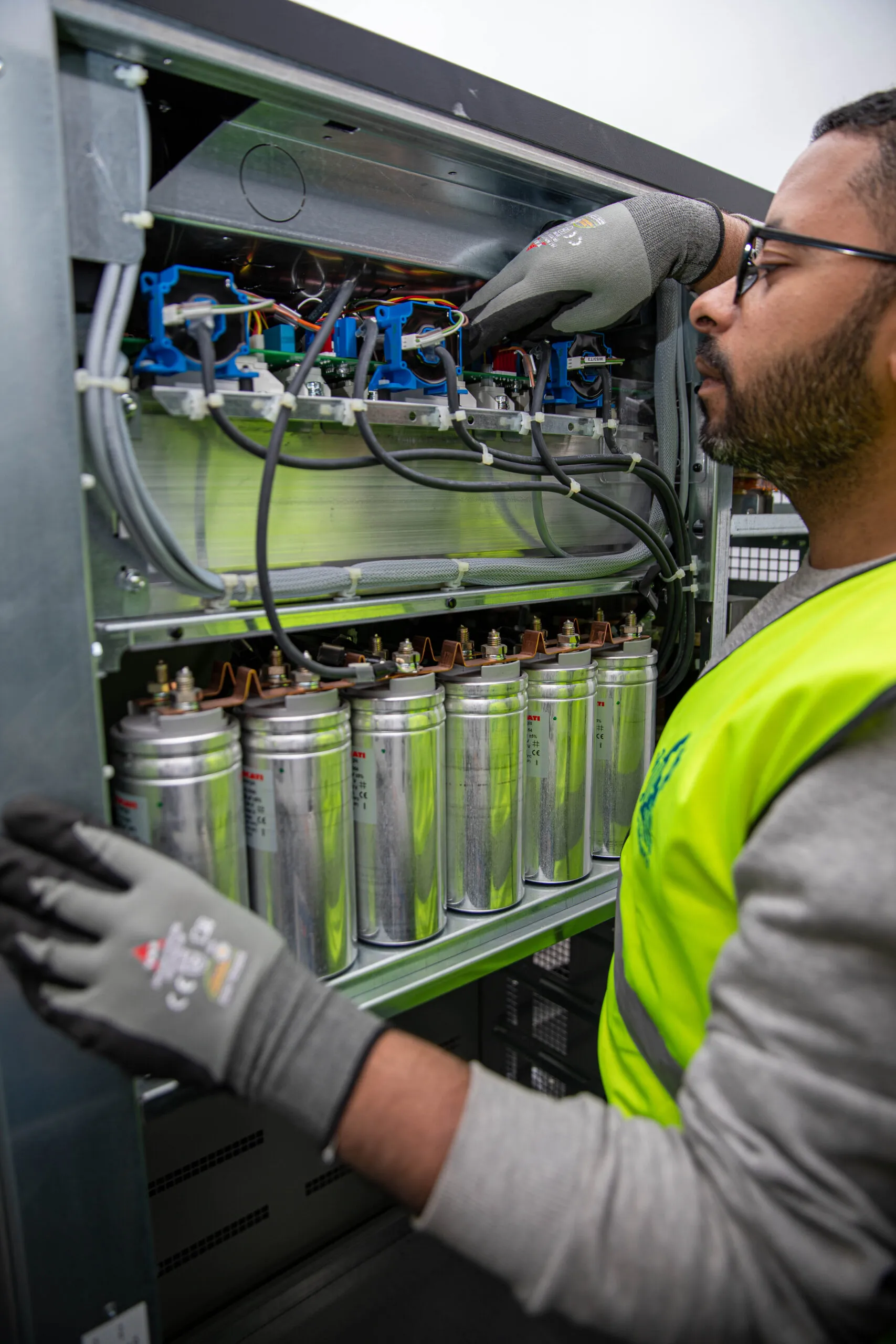 01 Electronics engineer servicing the capacitors of a UPS system